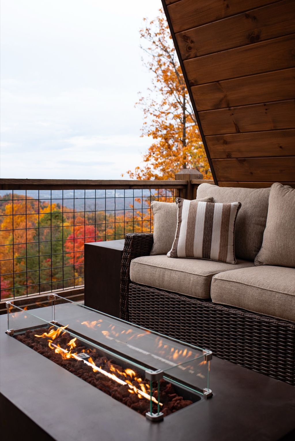 Deck lounge with fire table and fall views