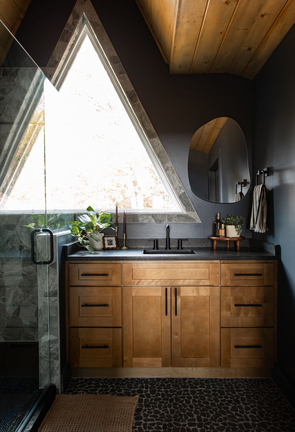Bathroom vanity under the A-frame window