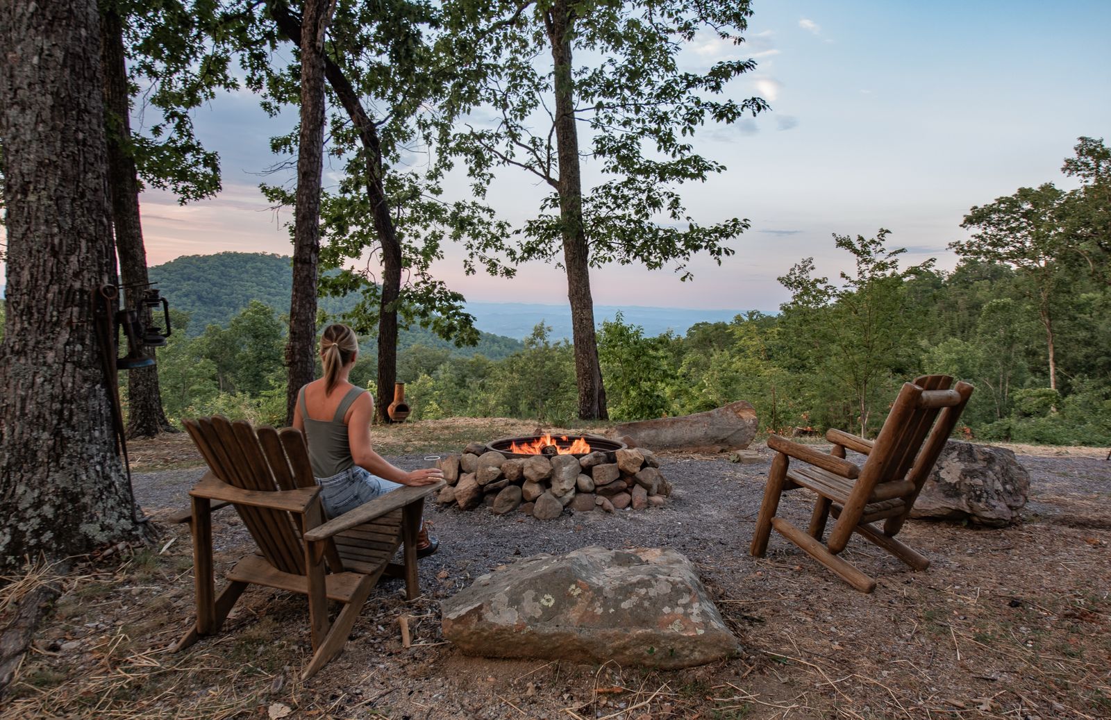 Guests by the fire pit looking out over the Smoky Mountain foothills
